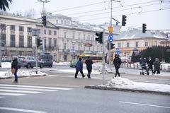 Winter street scene in Warsaw with historic buildings under a blue sky in January 2018