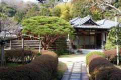 Entrance hall of Jufukuji Temple in Kamakura, Japan surrounded by lush greenery