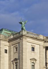 Statue of Fortuna at a corner of the Neue Burg, Hofburg palace in Vienna, Austria