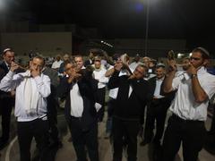Man blowing the Shofar on Israel Independence Day in Yokneam Illit