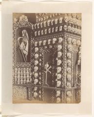 Ossuary with skulls arranged in an eerie chapel interior in Valletta, Malta
