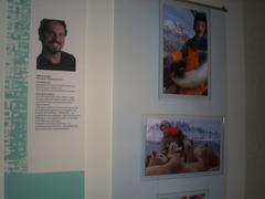 Temporary exhibition at the University Museum of Tromsø with visitors viewing displays