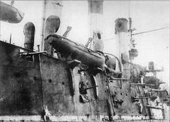 Damage to the central portion of the right side and smokestacks of the cruiser Aurora