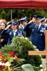 U.S. Air Force Colonels Tim Burke and Mary Peterson saluting at General Franciszek Gangor's funeral in Warsaw