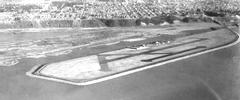 Aerial view of Swan Island Municipal Airport with adjacent Willamette River