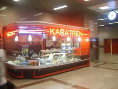 Istanbul Metro Taksim Station Karatren kiosk interior with colorful signage and people