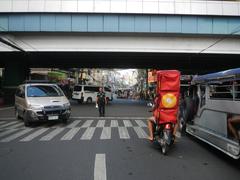 Arnaiz Avenue and Libertad Road intersection with Pasay Road in Pasay City showing the Libertad LRT Station, Holy Trinity Parish Church, and Victory Pasay Mall