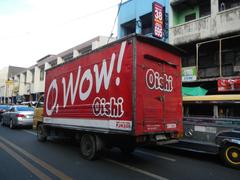 Arnaiz Avenue at Libertad Road intersection with Pasay Road in Pasay City, Manila, featuring Holy Trinity Parish Church and Victory Pasay Mall