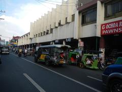 Arnaiz Avenue intersection with Libertad Road and Pasay Road in Pasay City with landmarks Holy Trinity Parish Church and Victory Pasay Mall
