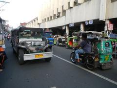 Arnaiz Avenue Libertad Road and Pasay Road intersection in Pasay City with Holy Trinity Parish Church and Victory Pasay Mall in background