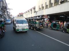 Arnaiz Avenue intersection with Libertad Road and Pasay Road in Pasay City featuring Holy Trinity Parish Church and urban surroundings