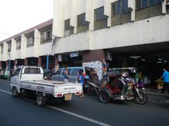 Arnaiz Avenue intersection with Libertad Road and Pasay Road in Pasay City featuring Holy Trinity Parish Church and urban landmarks