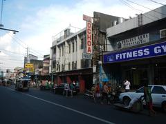 Arnaiz Avenue in Pasay City showing busy street with vehicles and buildings including St. Mary's Academy – Pasay