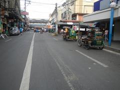 Arnaiz Avenue intersection near Libertad LRT Station with busy urban traffic in Pasay City, Manila