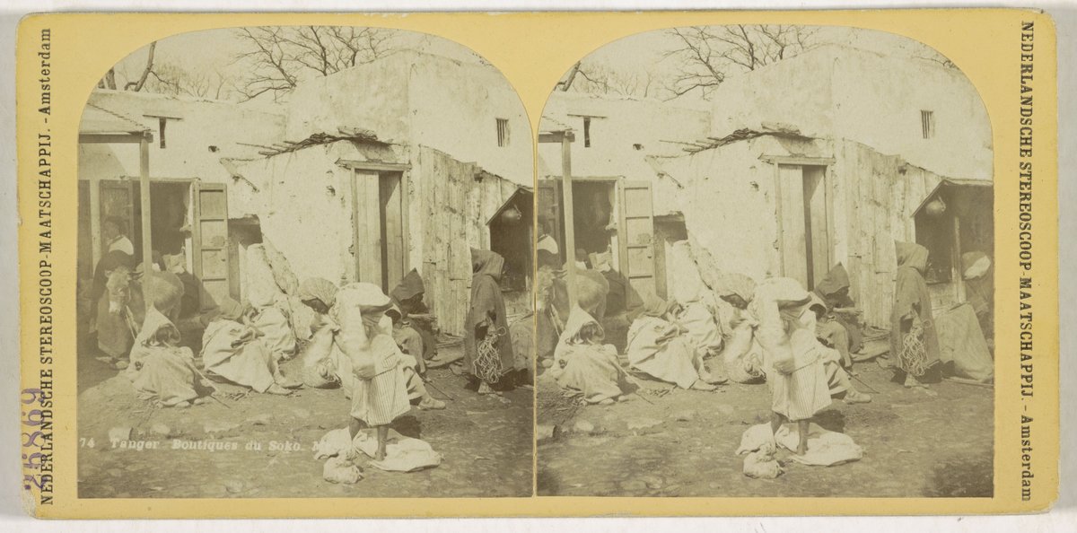 Vintage street view of Petit Socco market area in Tangier, Morocco showing market booths and shops from 19th century