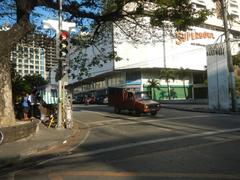 Skyscrapers and commercial buildings along Chino Roces Avenue in Pio del Pilar Makati City with signage for Makati Cinema Square Tower and Super 8 Grocery Warehouse