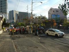Buildings along Chino Roces Avenue near Pio del Pilar in Makati City featuring Makati Cinema Square Tower, Plaza Fair, Super 8 Grocery Warehouse, AMF Puyat Superbowl and Billiards Center, and Paseo de Roces Legaspi Tower