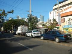 High-rise buildings and commercial establishments along Chino Roces Avenue in Pio del Pilar, Makati City, including Makati Cinema Square Tower and Plaza Fair