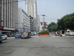 Kalaw Avenue view with Luneta Hotel, Eton BayPark Manila, Rizal Park and Ermita district in Manila with Manila Bay and Roxas Boulevard in the background