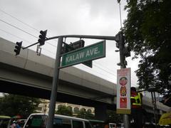 Street scene with a sidewalk cafe and pedestrians in Ermita, Manila
