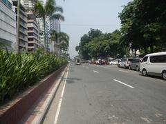 View of Kalaw Avenue along Roxas Boulevard near Rizal Park and Manila Bay showing hotel and park landmarks in Ermita, Manila