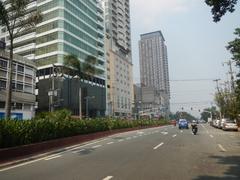 Kalaw Avenue and Rizal Park area with Luneta Hotel, Eton Baywalk Manila, and Manila Bay view at sunset
