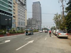 Kalaw Avenue and Roxas Boulevard intersection near Rizal Park in Ermita, Manila showing hotels, park entrances and Manila Bay coastline
