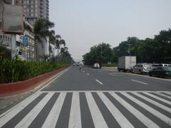 Kalaw Avenue with Luneta Hotel, Eton Baywalk Manila, Rizal Park, Ermita district, City of Manila skyline along Manila Bay and Roxas Boulevard