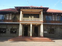 Kapitan Moy Residence heritage house and museum in Marikina City, Philippines with a stone monument in front