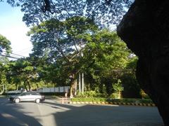 San Antonio Plaza at McKinley Road in Forbes Park, Makati City with modern buildings and parked cars