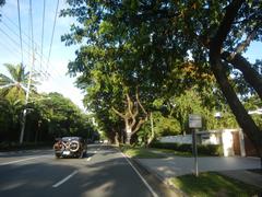 San Antonio Plaza along McKinley Road in Forbes Park, Makati City with well-maintained greenery and buildings