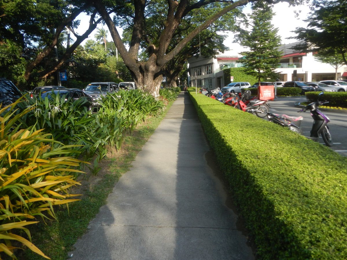 Santuario de San Antonio Parish Church Plaza in Forbes Park, Makati City with historic chapels and lush greenery