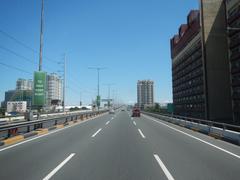South Luzon Expressway and Metro Manila Skyway aerial view showing highway intersections and cityscape in Makati