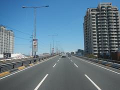 Aerial view of South Luzon Expressway and Metro Manila Skyway near Gil Puyat Avenue in Makati City showing elevated roads and traffic