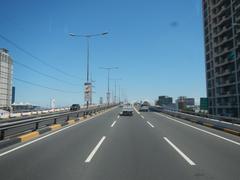 View of South Luzon Expressway and Metro Manila Skyway from bus driver's perspective in Makati City