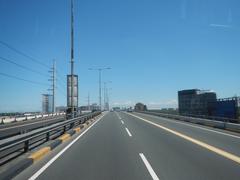 View from a bus on South Luzon Expressway and Metro Manila Skyway in Makati City showing elevated highway and urban surroundings