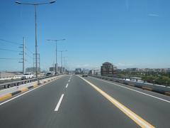 South Luzon Expressway and Metro Manila Skyway elevated expressways in Makati City, Philippines from bus driver's perspective