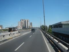 South Luzon Expressway and Metro Manila Skyway traffic view from a bus front window in Makati City
