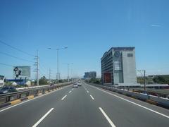 South Luzon Expressway and Metro Manila Skyway view from a bus driver's seat in Makati City, Philippines