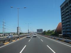 View from the front seat of a bus ascending the Metro Manila Skyway over South Luzon Expressway in Makati City