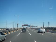 South Luzon Expressway and Metro Manila Skyway view from bus atop elevated roadway in Makati City