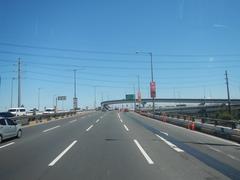 View from bus front window showing South Luzon Expressway elevated Skyway in Makati City Metro Manila Philippines