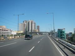 South Luzon Expressway and Metro Manila Skyway elevated highway from inside a bus in Makati City, Philippines