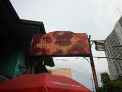 General Gregorio del Pilar Elementary School at the intersection of Abad Santos Avenue and Recto Avenue in Santa Cruz, Manila, with city landmarks and footbridge visible