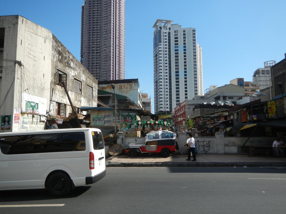 Claro M. Recto Bridge III over Estero de San Lazaro near Doroteo Jose LRT Station in Santa Cruz, Manila, featuring busy streets with buses and buildings