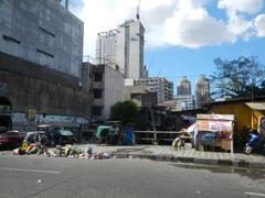 Claro M. Recto Bridge III and surrounding streets in Santa Cruz, Manila with Doroteo Jose LRT Station and landmark buildings under a cloudy sky