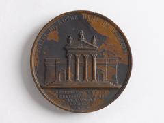 Commemorative medal showing right-facing bust of Louis XVIII and facade of Notre-Dame de Lorette with inscriptions about the blessing and laying of the first stone on August 25, 1823