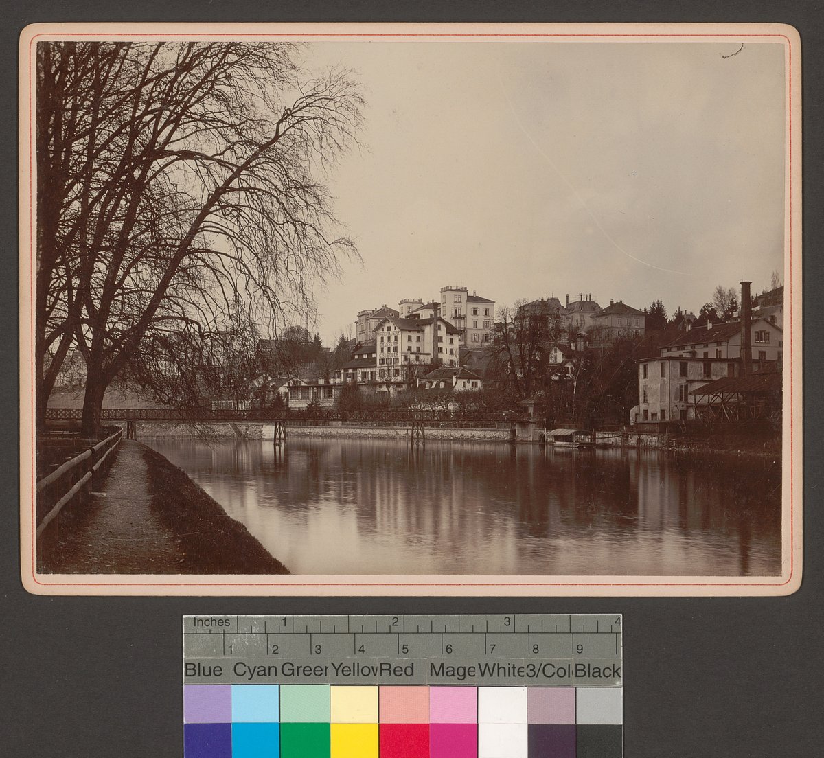Drahtschmidlisteg bridge over the Limmat River viewed from Platzspitz in Zurich with building signage 'Bierbrauerei Brasserie G. Steuble'