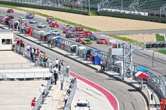 Start of Imola GT Open race with multiple GT cars on the track