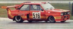 Italian race car driver Giorgio Pianta driving the Fiat Abarth 031 prototype at Imola racetrack in 1975